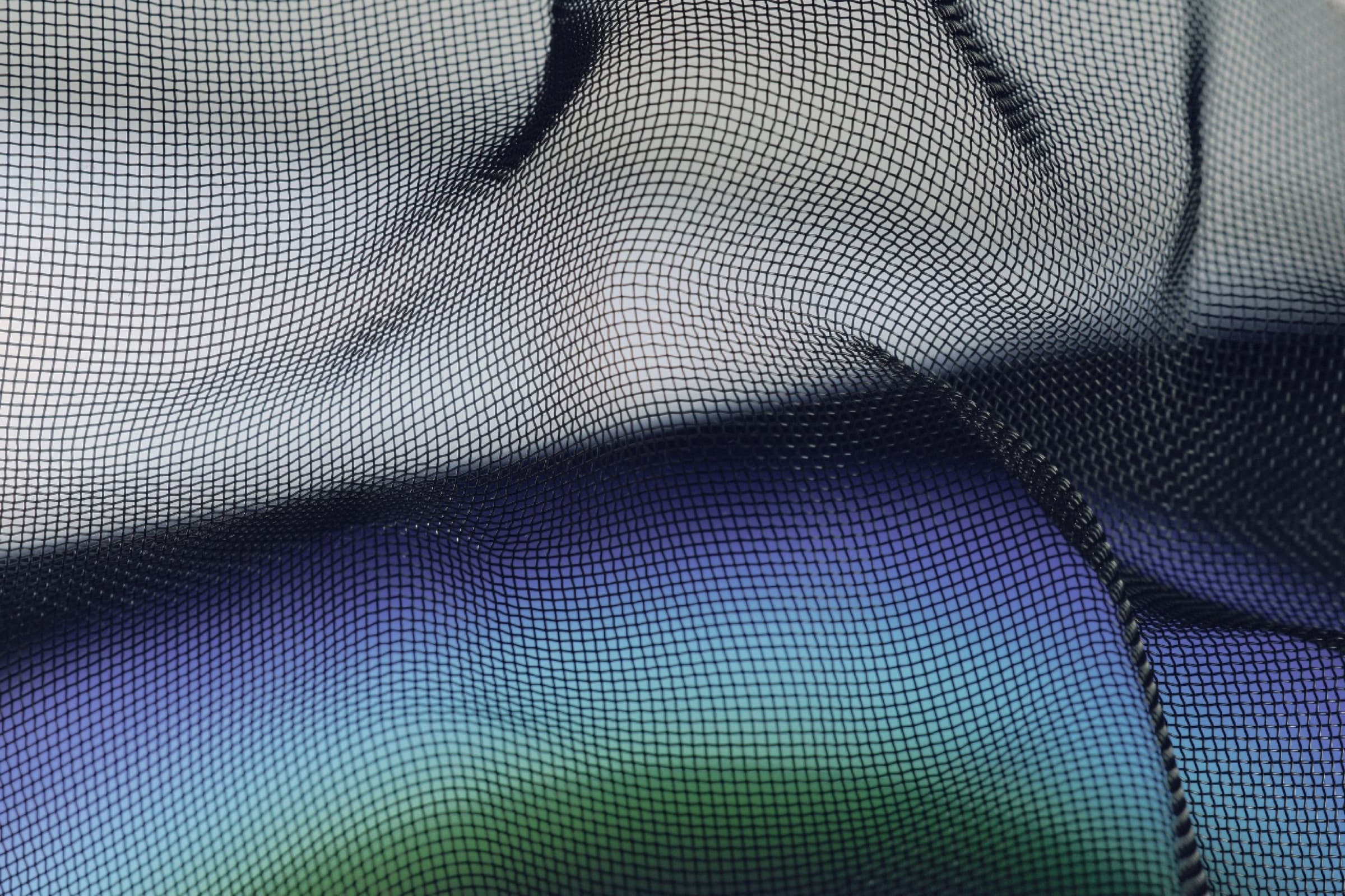 Mesh fabric over a gradient of light